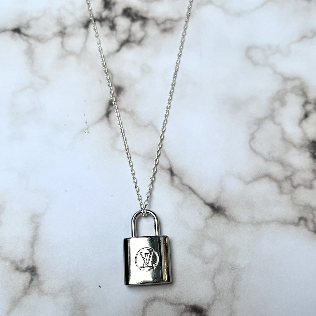 Louis Vuitton Lock Necklace –